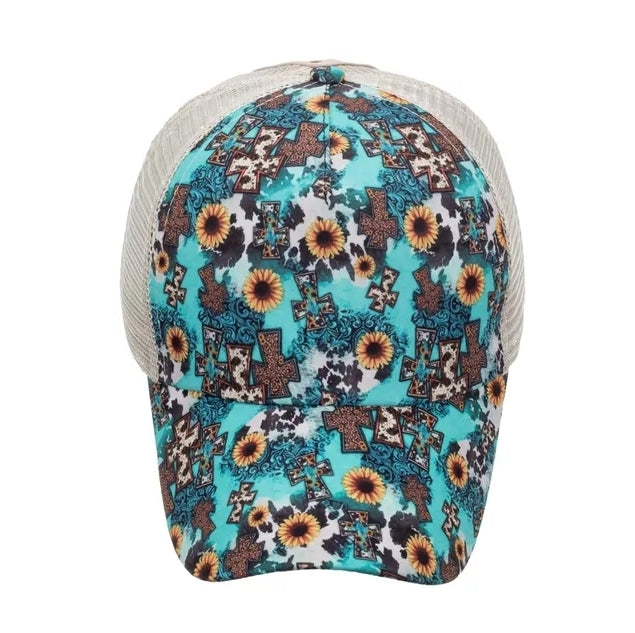 This hat is Turquoise with Cow Pattern with Sunflowers and Crosses, Criss-Cross Ponytail Baseball Hat